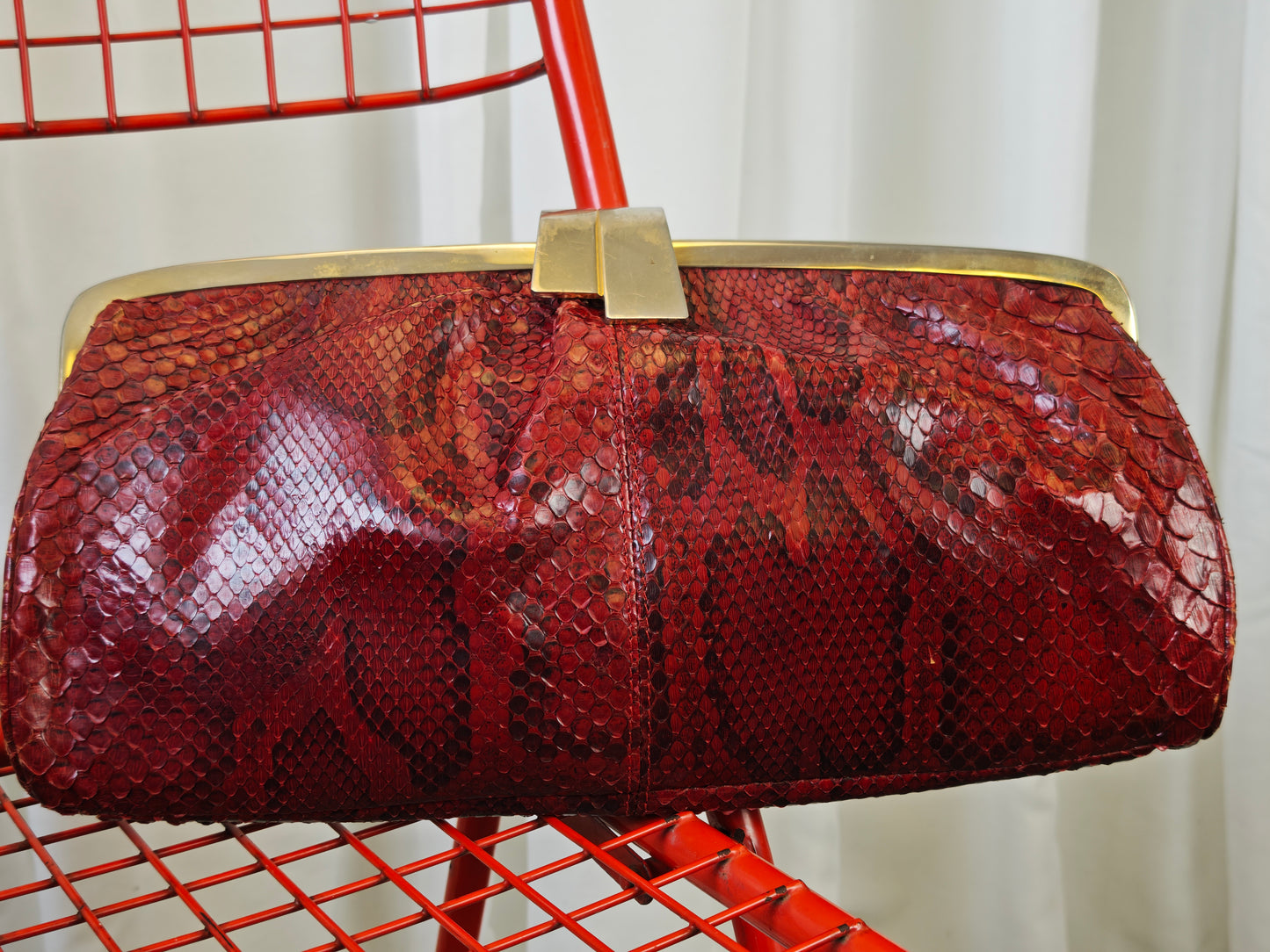 Burgundy snake clutch